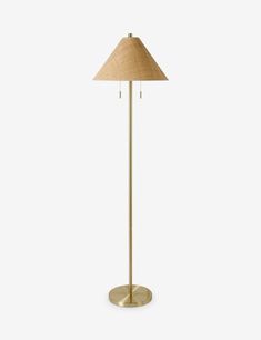 a gold floor lamp with a beige shade on the base and a light brown shade on the top