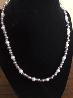 This pearl necklace is a great accessory for any occasion. The materials used for this necklace include purple and white pearl beads with clear glass beads. This necklace features a spring ring clasp with eyelet closure. *If you like this necklace but need it in another size, please contact me, and I will gladly make a necklace for you in the size you need. :) Purple Pearl Single Strand Jewelry, Purple Single Strand Pearl Jewelry, Purple Round Beads Pearl Necklace For Gift, Handmade Purple Pearl Necklace With Round Beads, Purple Pearl Jewelry With Colorful Beads, Purple Pearl Single Strand Necklace, Purple Single Strand Pearl Necklace, Adjustable Purple Pearl Necklace With Round Beads, Adjustable Purple Pearl Necklace