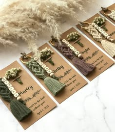 six different tassels with the words happy on them are laid out next to each other