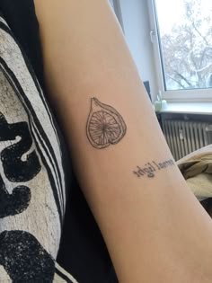 a person with a tattoo on their arm that reads, i am not light and has a slice of pizza in it