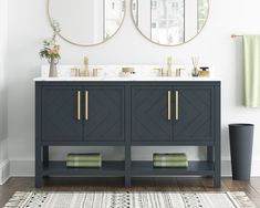 a bathroom with two round mirrors above the sink and rug on the floor next to it