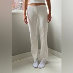 Cozy Light Weight Low Rise Pajama Pants In White With The Eyelet Print And An Elastic Waistband Fabrics: 100% Cotton Measurement: 9" (23 Cm) Rise, 26" (66 Cm) Inseam, 25" (64 Cm) Waist (Stretches) Made In: Italy Fitted Wide-leg Ribbed Pants, Fitted Ribbed Wide-leg Pants, Fitted Wide-leg Loungewear Bottoms, Fitted Wide-leg Loungewear Pants, Trendy Fitted Sweatpants For Loungewear, Elegant White Ribbed Bottoms, Ribbed Loungewear Bottoms For Spring, Casual Fitted Loungewear Bottoms, Spring Ribbed Loungewear Bottoms