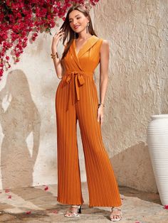 This beautiful and elegant Collar Pleated Belted Shirt Jumpsuit is perfect for any occasion. The shawl collar and pleated detailing give a classic look, while the belted and wrapped design adds a touch of modern sophistication. The long length and high waistline give it a flattering fit, and the regular fit is comfortable and easy to wear. This orange and blue dress is sure to be a wardrobe staple and will make you look and feel amazing. Specifications: Style: Elegant Pattern Type: Plain Details Elegant Sleeveless Pleated Jumpsuits And Rompers, Elegant Sleeveless Pleated Jumpsuit And Romper, Chic Pleated Jumpsuits And Rompers For Evening, Elegant Pleated Jumpsuits And Rompers For Party, Chic Pleated Evening Jumpsuits And Rompers, Chic Formal Belted Jumpsuits And Rompers, Chic Belted Jumpsuits And Rompers For Formal Occasions, Chic Belted Jumpsuits And Rompers For Formal Events, Chic Sleeveless Pleated Jumpsuits And Rompers