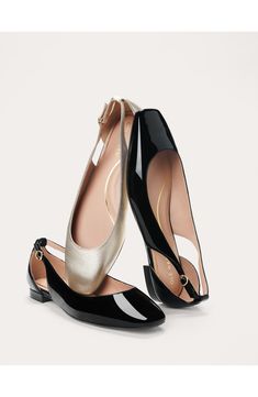 The classic ballet flat gets a contemporary refresh in a unique silhouette with slingback-inspired side cutouts that shut with a gleaming buckle closure. Adjustable slingback strap with buckle closure Leather upper and lining/synthetic sole Imported Elegant Ballet Flats With Ankle Strap, Elegant Party Flats With Buckle Closure, Evening Pointed Toe Ballet Flats With Buckle, Elegant Ballet Flats With Heel Strap, Elegant Evening Flats With Ankle Strap, Elegant Patent Leather Flats With Ankle Strap, Chic Black Ballet Flats With Buckle Closure, Elegant Ballet Flats With Buckle Closure, Elegant Flat Patent Leather Slingback Pumps