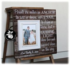 an old wooden frame with a wedding photo on it and the words written in cursive font