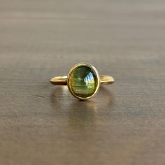 Translucent, vivid green tourmaline is bezel set in bright gold. 18k yellow gold Tourmaline 5/16" x 3/8" Cats Eye Ring, Organic Style, Newport Ri, Eye Ring, Bright Gold, Green Tourmaline, Bezel Setting, Newport, Cat Eye