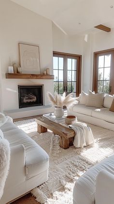 a living room filled with furniture and a fire place in the middle of a room