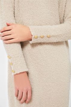 As cozy as a sweater as it is a chic dress, Nelle will take you from clocking hours at the office to dinner followed by a show with a quick switch of accessories. Crafted from a creamy tan boucle knit fabric with gold buttons detailed on the cuffs, this minimalistic maxi is ready to be dressed up or down. With a relaxed fit that is as comfortable as it is flattering, we are wearing this with heels and gold jewelry for a timeless look. Crew neckline Long sleeves Gold buttons on cuffs Relaxed fit Boucle Knit, Gold Buttons, Chic Dress, Shoulder Sleeve, Crew Neckline, The Office, Knit Fabric, Knitted Fabric, Gold Jewelry