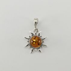 These is a beautiful Sterling Silver Pendant with Amber. The pendant is made out of solid 925 Silver and there is no nickel or other substances causing most allergies. This makes the pendant hypo allergenic. Size of the Pendant in total - with the bail 2.5 x 1.6 cm or  0.98 x 0.63 inch You will receive the item in a gift box - perfect to surprise someone or yourself. Usually we ship on the same day we receive the payment for the order. We want you to be happy with your purchase. If you do not li Silver Baltic Amber Necklace With Polished Finish, Baltic Amber Pendant Jewelry With Polished Finish, Baltic Amber Pendant With Polished Finish, Polished Baltic Amber Pendant Jewelry, Silver Baltic Amber Jewelry As Gift, Silver Baltic Amber Jewelry For Gift, Nickel-free Round Amber Jewelry, Amber Sterling Silver Pendant Jewelry, Amber Sterling Silver Round Pendant Jewelry