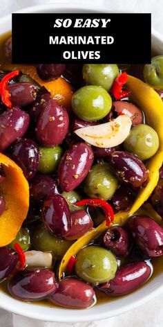 a bowl filled with olives, oranges and other vegetables next to the words so easy marinated olives