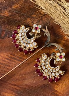 Celebrate the rich heritage of traditional jewelry with our "Heritage Echo" Traditional Earrings, meticulously crafted to echo the opulence of a bygone era. These earrings feature the timeless combination of a deep red stone and uncut Kundan, paying homage to tradition and artistry. They are a versatile and captivating accessory that adds grace and cultural significance to your attire. Materials: Deep Red Stone: The earrings feature a deep red stone, chosen for its rich and vibrant hue, symboliz Traditional Jewelry Gift Set With Matching Earrings, Kundan Temple Jewelry Earrings, Traditional Heavy Kundan Pearl Earrings, Temple Style Tilla Earrings For Wedding, Round Hand Set Chandelier Earrings As Gift, Elegant Round Tilla Bridal Earrings, Traditional Pearl Earrings With Latkans And Dangle, Festival Kundan Temple Jewelry Earrings, Kundan Temple Jewelry Earrings For Festivals