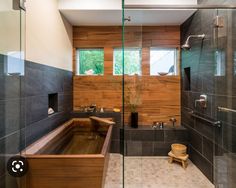 a bath tub sitting inside of a bathroom next to a walk in shower