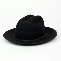 Our newest release is a hard wool style that also features a brand new crown shape. This Cattleman crown shape on our Field Fedora is a throwback to classic American headwear. A 2 3/4" flange up brim with brim binding. All leather is manufactured in a solar and wind powered facility that collects 27,300 tons of rainwater per year, and uses 50% natural light energy. Fit: Due to the stiff/firm nature of our hard wool, we recommend to check your head shape on our online fit guide below. The Field F Classic Top Hat With Flat Crown For Fall, Classic Fall Top Hat With Flat Crown, Classic Flat Crown Top Hat For Fall, Classic Adjustable Fedora For Town, Classic Adjustable Fedora, Classic Curved Brim Fedora For Winter, Classic Brimmed Hat For Town, Classic Winter Fedora With Curved Brim, Classic Fedora Hat For Town