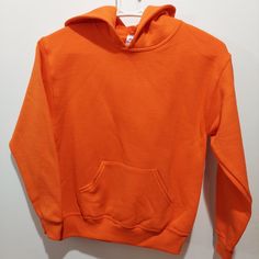 Nwot. Youth Jerzees Nublend. Orange. Medium. Center Pocket. Hoodie Plain Fleece Hoodie For Fall, Basic Sweatshirt With Adjustable Hood, Cozy Fit Solid Hooded Top, Orange Hoodie Sweatshirt For Winter, Solid Cotton Sweater With Kangaroo Pocket, Basic Hoodie For Sports, Orange Cotton Hooded Top, Plain Hooded Top For Fall, Basic Hooded Tops For Winter