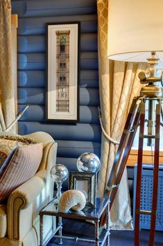 a living room with blue walls and furniture