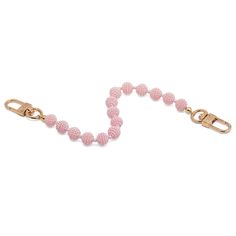 a pink beaded dog leash with gold clasps and a metal hook on a white background