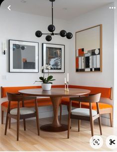 a dining room table with two chairs around it