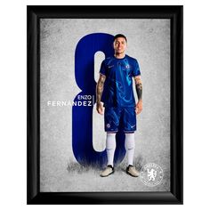 a man with tattoos standing in front of a blue number 8 sign and wearing soccer shoes