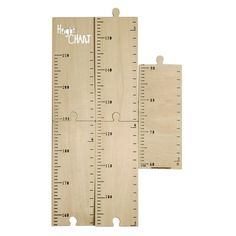 two wooden rulers with white writing on them and one ruler is measuring the height of each piece