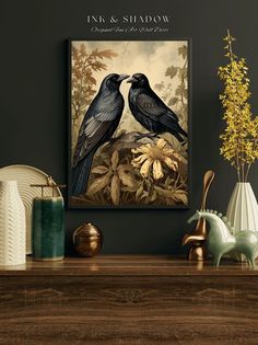 two black birds sitting on top of a wooden table next to vases and flowers