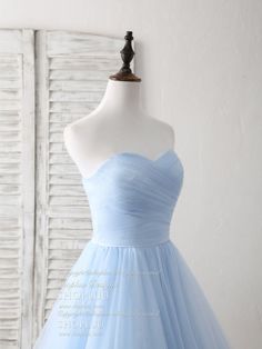 Blue Fitted Tulle Bridesmaid Dress, Fitted Blue Tulle Bridesmaid Dress, Blue Tulle Skirt Dress For Debutante Ball, Blue Tulle Bridesmaid Dress For Prom Season, Blue Tulle Bridesmaid Dress For Prom, Blue Dress With Tulle Skirt And Fitted Bodice, Fitted Blue Tutu Dress For Wedding, Elegant Blue Tutu Dress For Wedding, Blue Sleeveless Tulle Tutu Dress