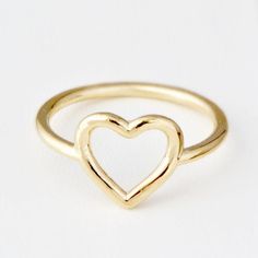 ♥ Real Gold Ring ♥A cute heart ring, perfect for somebody who likes simple and classic jewelry. The band is 10K Yellow Gold and about 1mm round. The heart itself is just under 1/2 an inch from the bottom point of the heart to the top of the heart. These are made in our studio, so we can make it any size you like :) The ring will be polished to a high mirror finish and sent in a white gift box.D E T A I L S• Made to Order in any size• Genuine 14K Gold (Rose, Yellow or White)• The thickness of app Classic Everyday Heart Ring For Valentine's Day, Simple Gold Heart Ring For Valentine's Day, Simple Heart Ring For Valentine's Day, Everyday Open Heart Rings With Heart Charm, Simple Heart-shaped Promise Ring, Heart Shaped Stackable Rings For Valentine's Day, Classic Heart-shaped Stackable Rings For Valentine's Day, Simple Heart Rings For Valentine's Day, Simple Heart-shaped Rings For Valentine's Day