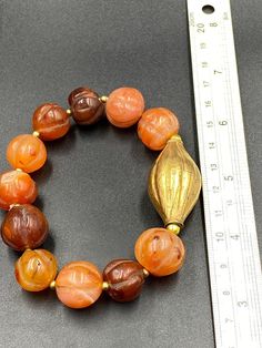 Old ancient carnelian pumpkin shape beaded bracelet Vintage Amber Jewelry With Large Beads, Handmade Orange Spiritual Bracelets, Amber Rondelle Gemstone Beads Jewelry, Orange Carnelian Hand-strung Bracelets, Amber Gemstone Beads Rondelle Jewelry, Orange Hand-strung Carnelian Bracelets, Handmade Carnelian Amber Bracelets, Hand-strung Orange Jewelry With Round Beads, Orange Hand-strung Jewelry With Round Beads