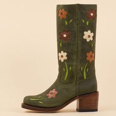 These cowgirl boots feature a dark green hue, square toe design, block heel for comfort, and blossom detailing around the mid-calf area, blending classic Western style with contemporary flair. Color: Dark green Heel Type: Block heel Heel Height: 2.36" / 60 mm approx Shaft Height: 11.81'' / 300 mm approx Product measurements were taken using size 8. Please note that measurements may vary by size. Toe: Square toe Flower blossom design Pull-on design Handcrafted US sizing. Fits true to size. Sunflower Cowgirl Boots, Retro Boots, Cowboy Boots For Women, Flower Boots, Green Boots, Green Heels, Green Square, Shoe Inspiration, Cowboy Boots Women