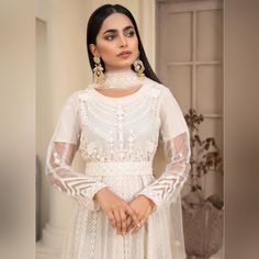 Introducing The Pakistani Brand Name Zebaye Off-White Pret For Women Tulle/Net Fabric Sequinced And Embroidered Womenswear Dress Lady Comfort Maxi! This 3-Piece Outfit Includes A Top, Bottom, And Dupatta, All Made From High-Quality Net Fabric. The Beautiful Maxi Dress Is Delicately Embroidered With Intricate Details That Are Sure To Turn Heads. The Outfit Also Features A Separate Net Embroidered Belt That Adds A Touch Of Elegance To The Design. The Dress Is Perfect For All Seasons And Will Make White Dresses With Pearl Embroidery For Reception, Festive White Dresses For Reception, Festive White Dress For Reception, Festive White Reception Dress, White Fitted Anarkali Dress, Elegant White Dress With Pearl Embroidery, Elegant Cream Sets With Lace Work, Fitted White Festive Dress, Festive White Fitted Dress