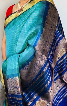 A beautiful handloom silk cotton in light blue body and dark blue border contrast with zari checks through out the body. The body and border has packed zari design in geometric patterns.  Comes with contrast blue color running blouse piece. Pico done Fall - NOT done Blue Border, Silk Cotton Sarees, Geometric Patterns, Cotton Saree, Blouse Piece, Geometric Pattern, Dark Blue, Checks, Light Blue