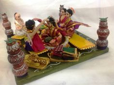 figurines sitting on top of a green tray