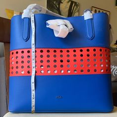 Blue & Red Leather Tote Bag. Interior Pocket And Small Wallet Bag With Clip Attachment. Comes With Bag Case. Never Been Used! Brand New! Still Wrapped. Blue Bucket Shoulder Bag With Top Carry Handle, Blue Bucket Shoulder Bag With Top Handle, Modern Blue Bucket Shoulder Bag, Blue Large Capacity Shoulder Bag For Office, Blue Bucket Satchel With Detachable Handle, Blue Bucket Bags For Errands, Blue Bucket Satchel With Large Capacity, Blue Bucket Satchel For Shopping, Blue Tote Office Bags