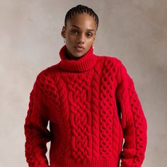 Blending soft Italian wool and alpaca yarns a chunky Aran-knit pattern lends inviting texture to this turtleneck sweater.