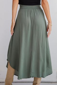 If you have iconic intentions, then the Sensational Purpose Olive Midi Skirt is the perfect look to achieve them! Designed with a flattering high-waisted fit, this skirt gracefully drapes to a midi length, creating a beautiful, flowing silhouette that moves with you. The rich olive hue adds a sophisticated, earthy tone that pairs beautifully with both neutrals and vibrant colors, making it a versatile addition to any closet. Crafted from lightweight, breathable fabric, this skirt offers a soft, Solid Non-stretch Lined Maxi Skirt, Non-stretch Lined Maxi Skirt, Chic Flowy Skirt In Solid Color, Flowy Tiered Skirt In Solid Color, Chic Non-stretch Lined Skirt, Chic Solid Color Lined Skirt, Flowy Solid Color Maxi Skirt, Chic Lined Skirt, Chic Flowy Lined Skirt