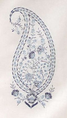 an embroidered piece of cloth with blue flowers and leaves on it, in the shape of a paisley