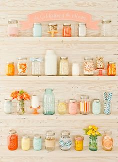 the shelves are filled with jars and flowers