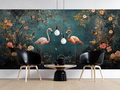 two flamingos are standing in front of a floral wall mural