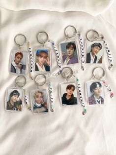 six keychains with pictures of the same person on them