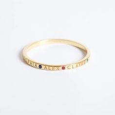 💍 14k Solid Gold Personalized Name Ring featuring custom names and birthstones, available in yellow, rose, or white gold. This minimalist stacking ring is perfect for celebrating family and loved ones. 🌟 Perfect For: Birthdays, Anniversaries, Mother's Day, or any special occasion. Order now to create a unique and meaningful keepsake! ✨ Material: Solid Gold (Not gold plated or gold fill) Karat: 14k (585) (ask me for 18K gold) Width of the band: 1.5 mm Available gold color: Yellow, rose, white Gemstone: Cz (Cubic Zirconia)   M o r e  *  F r o m  *  U s   Goldstore Jewelry - https://etsy.me/3gHtcrZ * Editor's Pick - https://etsy.me/3CCLlmm * Cremation Urn Jewelry - https://etsy.me/3MM0Lcq * Name Ring - https://etsy.me/3pVTAEU * Cross Ring - https://etsy.me/3ME16ho * Birthstone Ring - https: Ring With Birthstones, Family Ring, Family Rings, Name Ring, Masonic Ring, Name Rings, Evil Eye Ring, Cross Ring, Family Celebrations