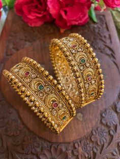 Elevate your traditional attire with our exquisite collection of Matt finish gold-plated Rajwada bangles. Each piece is a testament to craftsmanship, blending cultural richness with contemporary elegance. Our Indian jewelry ethnic kadas showcase timeless beauty, capturing the essence of tradition in every detail. Explore the allure of our temple jewelry-inspired bracelets, where heritage meets modernity. Embrace the legacy of fine craftsmanship with our traditional bangles, a celebration of Indian artistry that transcends time. Based on silver and copper alloy Highest quality and craftsmanship  You can pair these bangles with traditional banarsi sarees or lehengas. This will look great with zari silk sarees. We recommend you to wear this with pink or gold coloured saree. These bangles will Luxury Traditional Meenakari Bangle, Rajwada Bangles, Modern Indian Jewelry, Traditional Bangles, Inspired Bracelets, Banarsi Saree, Temple Jewelry, Bangles Indian, Traditional Attire