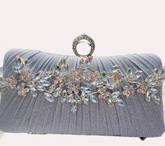 Fabulous design with a glittering touch.  Perfect finishing touch for any formal outfit.  Ideal for cocktail party or wedding.  Can be made in silver, gold or black. Glamorous Embellished Evening Bag For Events, Glamorous Evening Bag With Rhinestones For Party, Elegant Embellished Evening Bag For Party Season, Rectangular Evening Bag For Weddings And Parties, Wedding Clutch For Party Season, Silver Embellished Bags For Events, Elegant Embellished Bags For Party Season, Formal Sequin Bags For Party Season, Luxury Embellished Silver Bags