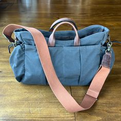 Excellent Condition. Weatherproof Waxed Cotton / Nylon Canvas. Waterproof Interior Liner. Leather Carry Handles And Adjustable Cotton Shoulder Strap. Six Exterior Pockets. Four Slip Pockets And Two Cinchable Side Pockets. Approx 10”Hx16”L Waxed Canvas Bag, Men's Toms, Vintage Tools, Tool Bag, Waxed Canvas, Waxed Cotton, Canvas Bag, Sewing Patterns, Shoulder Strap