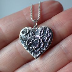 This is a sterling silver heart with a floral design made from recycled sterling silver♻️. The charm measures .8" long with the ring and is .8" wide. It will come on a 1mm round box chain on your choice of 16", 18" 20" or 24" long. Sterling Silver Heart Pendant With Flower Charm Jewelry, Sterling Silver Heart Pendant With Flower Charm, Stamped Sterling Silver Heart Pendant Jewelry, Sterling Silver Flower Jewelry Keepsake, Sterling Silver Flower Keepsake Jewelry, Sterling Silver Flower Jewelry For Keepsake, Stamped Sterling Silver Heart Jewelry, Stamped Heart Shaped Sterling Silver Jewelry, Sterling Silver Heart Stamped Jewelry