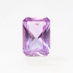 an amethyst purple diamond on a white background