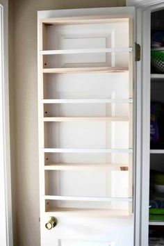 a white door with shelves in it