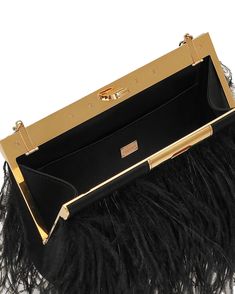 Dolce & Gabbana Medium Marlene Fringe Shoulder Bag in Black Vintage brass turn-lock fastening Chain shoulder strap Embellished ostrich feathers Satin lining Interior flat wall pocket 9” W x 5.5” H x 1.7” D Made in Italy Luxury Formal Bags With Feathers, Elegant Evening Bags With Feathers, Luxury Formal Feathered Bags, Chic Formal Bags With Feathers, Formal Chic Bags With Feathers, Chic Formal Feather Bags, Chic Formal Feathered Bags, Luxury Evening Bag With Feather Trim, Luxury Evening Bags With Feather Trim