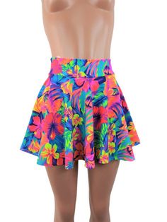 "Tahitian floral Neon print spandex skater skirt 15\" shown on mannequin.High waist skirt can be worn lower or higher most skirts allow you to place the waistline where it suits you on your particular body shape and personal desire! this fun flirty skirt is a full circle design and can be ordered in lengths of 10 inch, 12 inch, 15 inch and 19 inch- if you need a longer length contact me for a quote. Any of my items can be made in any spandex fabric, also any item can be matched if you like a ski Fitted Skort For Vacation, Tropical Stretch Bottoms With Floral Print, Stretch Tropical Bottoms With Floral Print, Tropical Stretch Floral Print Bottoms, Fitted Beach Skort, Fitted Beach Season Skort With Lined Skirt, Fitted Skort For Beach, Fitted Mini Skort For Beach Season, Fitted Mini Skirt Skort For Beach Season