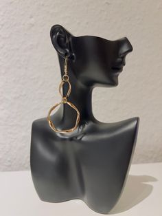 Twisted Infinity Loop Dangle Earrings feature an elegant, never-ending design that gracefully hangs with a sleek, elongated ring pendant, merging contemporary style with a touch of timeless allure. Materials: Stainless steel Available in gold and silver. Due to hygiene considerations, this product is not eligible for exchange. Elegant Gold Earrings With Simple Design, Elegant Adjustable Hypoallergenic Hoop Earrings, Elegant Simple Design Gold Earrings, Elegant Simple Gold Earrings, Single Metal Earring With A Modern Twist, Single Earring In Metal With A Modern Twist, Single Earring With A Modern Twist, Elegant Drop Earrings With Simple Design, Elegant Simple Drop Earrings