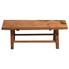 a wooden bench sitting on top of a white background