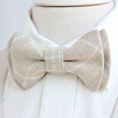 "Dapper Men's Natural Linen Windowpane Bow Tie Made By The Belle And The Beau! ♥ Beautiful linen/cotton blend yarn dyed woven fabric! Our dapper, modern, stylish, and charming neckties are perfect for everyday, Sunday best, all special occasions, photography sessions, and especially dapper on grooms and groomsmen! They are the perfect wedding accessory. We use the best cotton and cotton blend fabrics. We love that cotton is so versatile to dress up or down for any occasion. Each bow tie has a do Fitted Bow Tie For Father's Day, Classic White Tie For Wedding, Classic White Wedding Tie, Classic Summer Tie For Groom, Adjustable Dapper Ties With Bow Tie Back, Dapper White Adjustable Suit And Tie Accessories, Dapper White Suit And Tie Accessories For Summer, Dapper White Suit And Standard Tie Accessories, White Dapper Ties For Black Tie Events